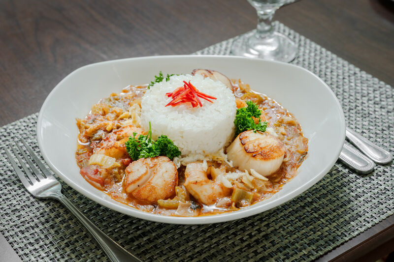 large bowl of jambalaya with rice, shrimp, and sausage